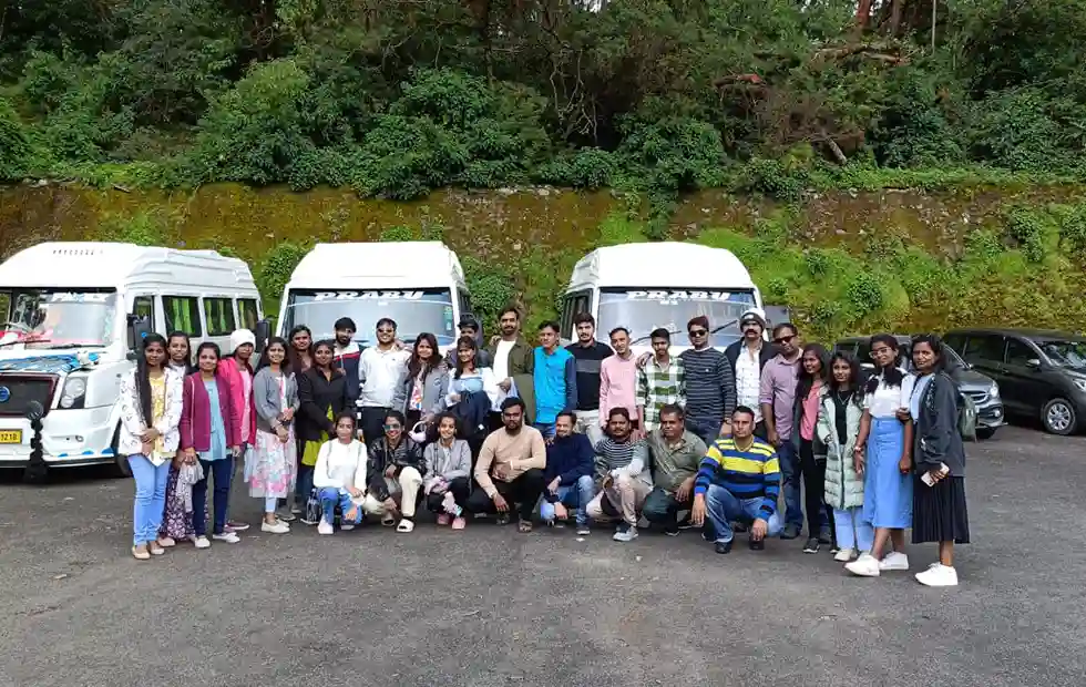 Group of passengers travelling together in an 18 seater tempo traveller booked from Coimbatore