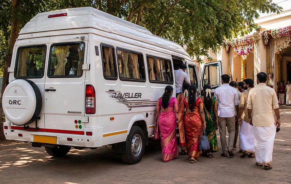 Wedding guests boarding a tempo traveller arranged for functions in Coimbatore